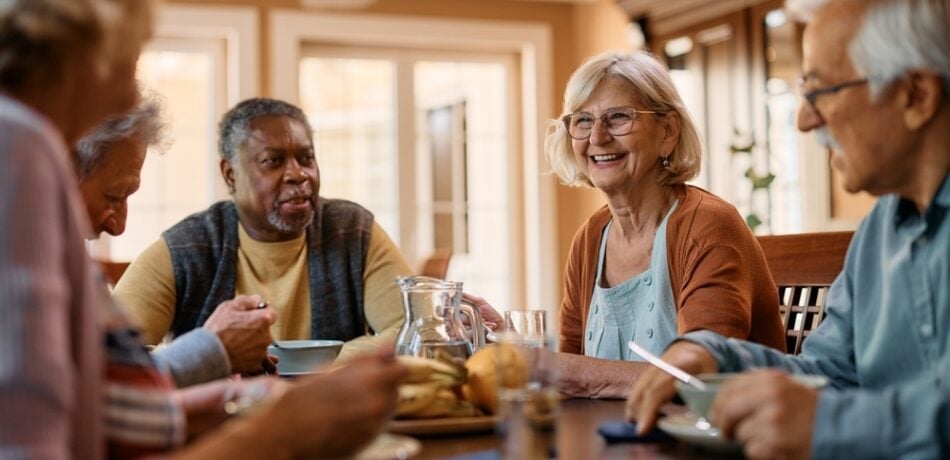 A group of older adults eating together.