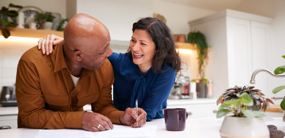 Couple reviews and signs paperwork.